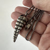 Snake Rattle Pendant Necklace in Sterling Silver by LA based artist, Dax Savage.