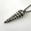 Snake Rattle Pendant Necklace in Sterling Silver by LA based artist, Dax Savage.