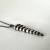 Snake Rattle Pendant Necklace in Sterling Silver by LA based artist, Dax Savage.