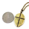 Custom Shield with Cross Pendant in Rock Star Brass by Dax Savage Jewelry.