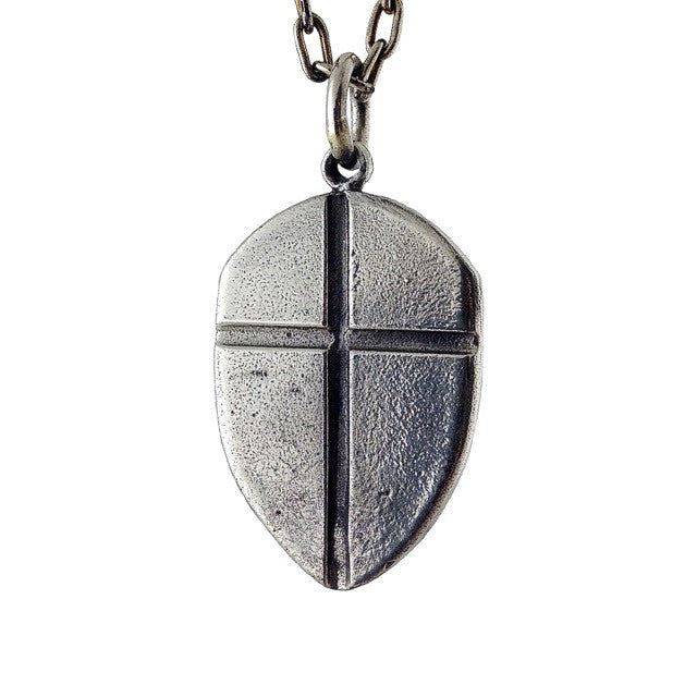 Custom Shield with Cross Pendant in Rock Star White Brass by Dax Savage Jewelry.