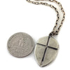 Custom Shield with Cross Pendant in Rock Star White Brass by Dax Savage Jewelry.