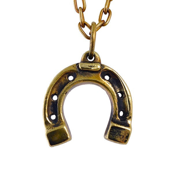 Custom Horseshoe Pendant in Brass by Dax Savage Jewelry.